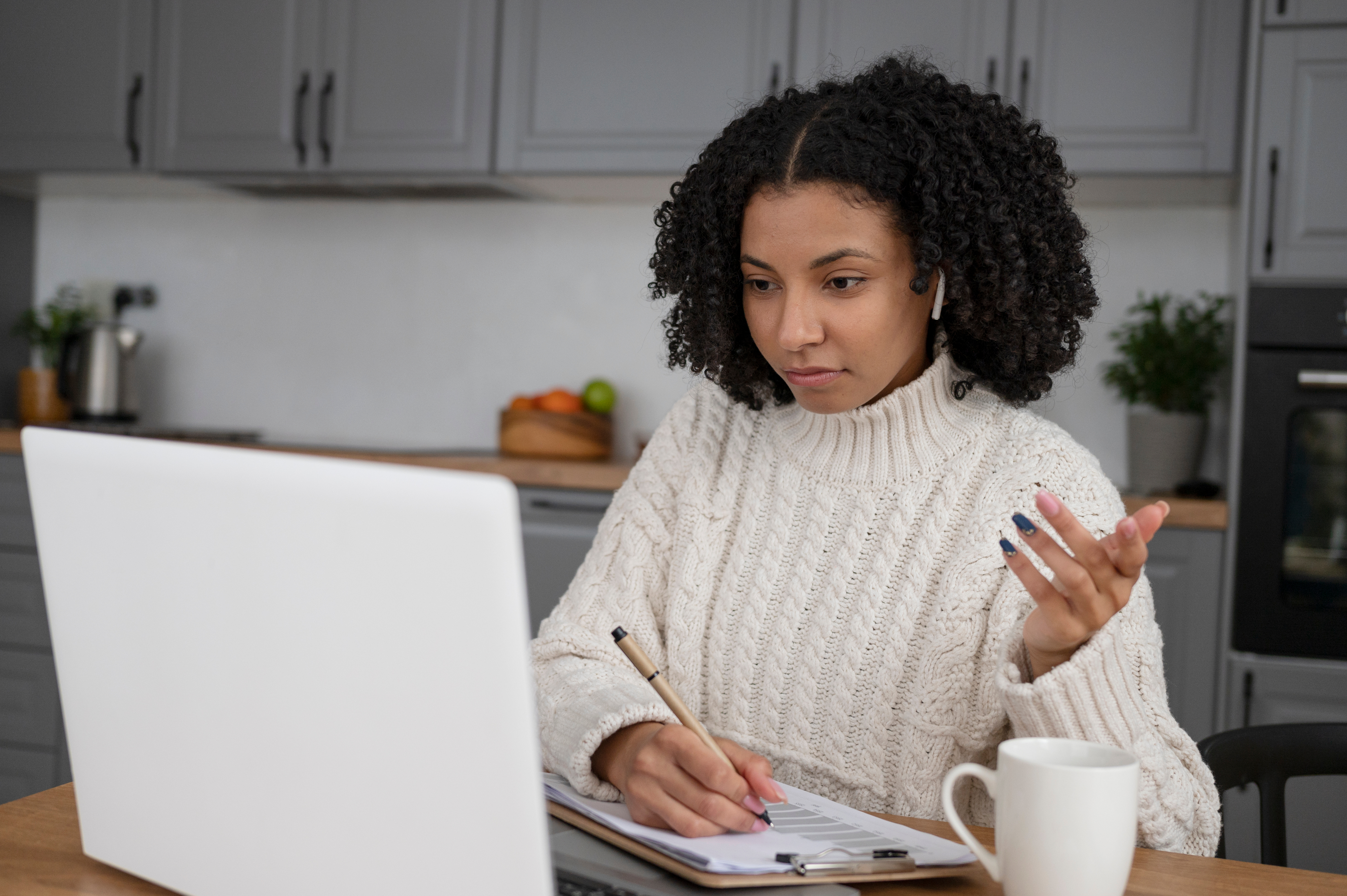 Person preparing a CV on a laptop